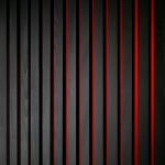 Holzverschalung schwarz lackiert kombiniert mit Stamisol Effect Rot